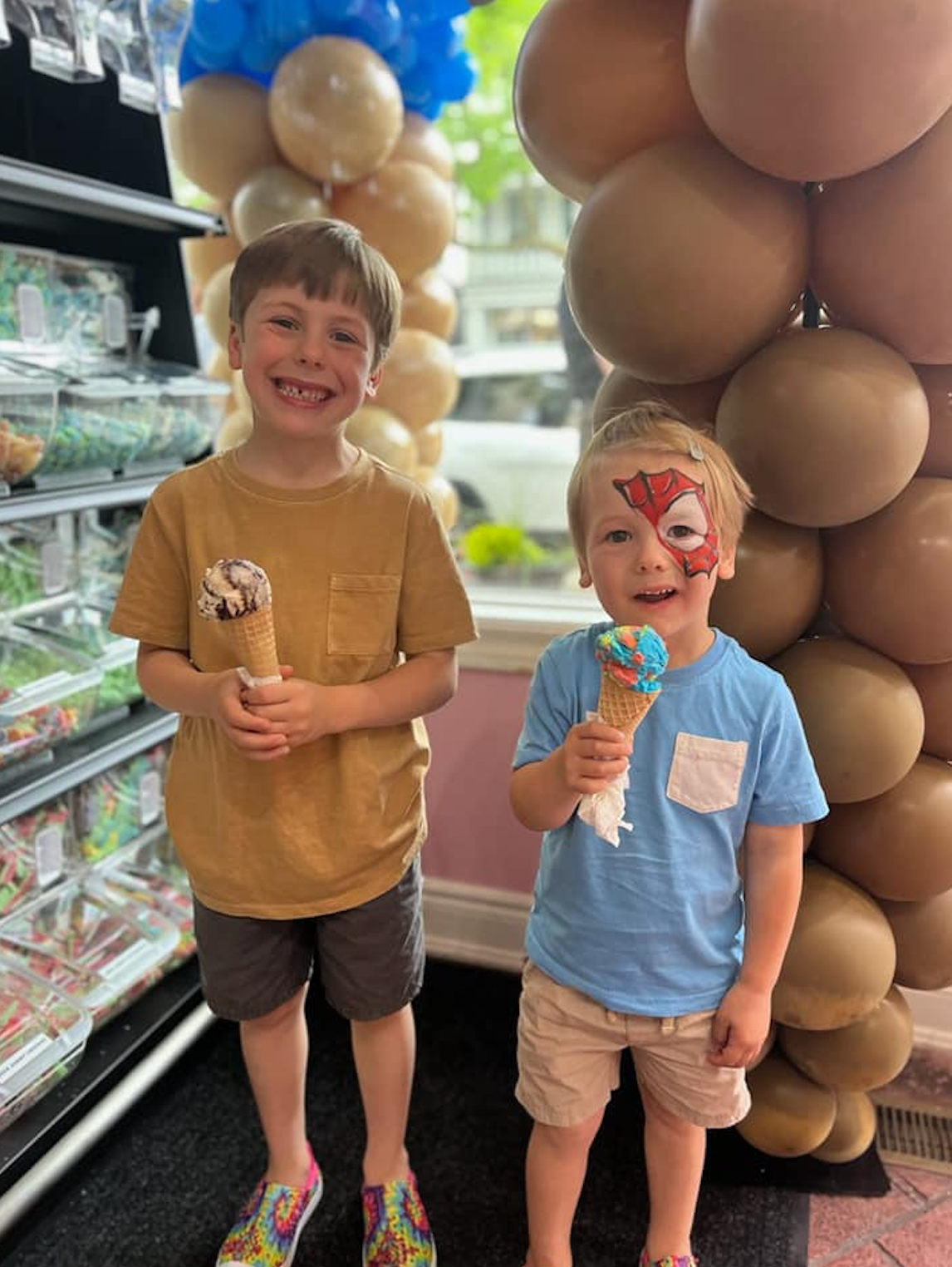 Children pose for a photo during the grand opening of Sweet Spot Saugatuck at 133 Butler Street.