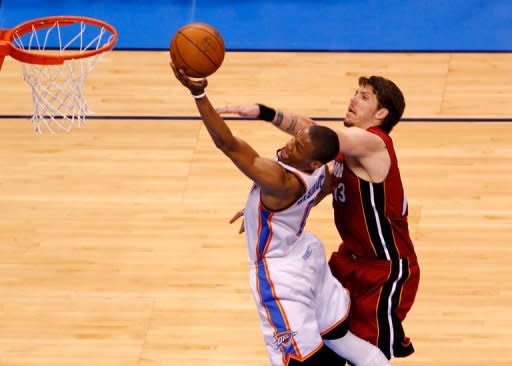 Oklahoma City Thunder's Russell Westbrook goes up for a shot next to Miami Heat's Mike Miller during the fourth quarter of the NBA Finals game one on June 12. Westbrook had 12 third-quarter points for the Thunder