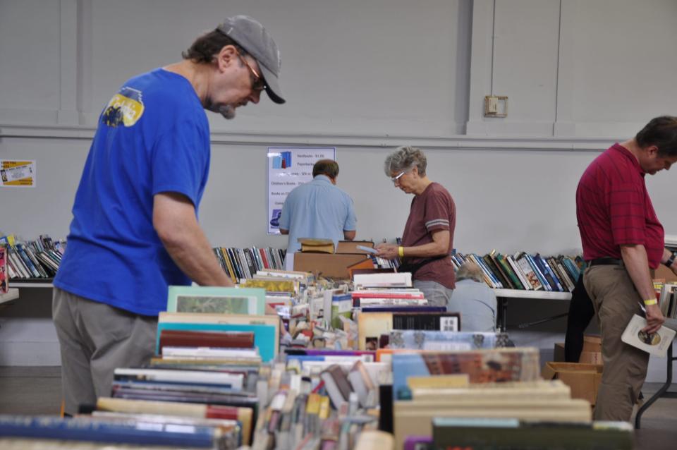 Dale Chryst of Sebring browses through the line of books at the 2023 Friends of Rodman Public Library Used Book Sale on Saturday, Aug. 5, 2023, at the Alliance Commons.
