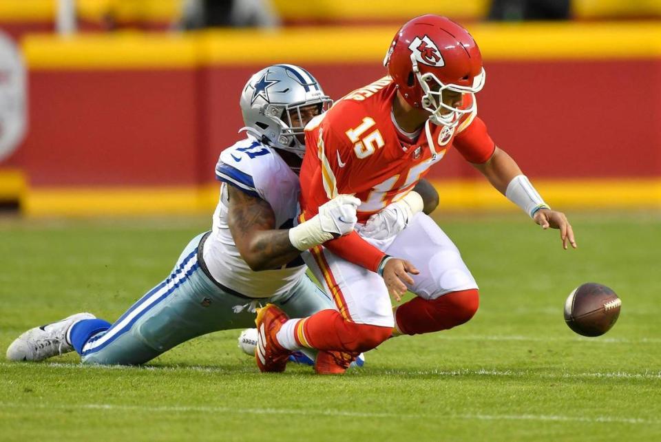 Dallas Cowboys outside linebacker Micah Parsons (11) sacks Kansas City Chiefs quarterback Patrick Mahomes (15) and forces a fumble during the first-half of the Dallas-Kansas City game on Sunday, Nov. 21, 2021 at Arrowhead Stadium in Kansas City.