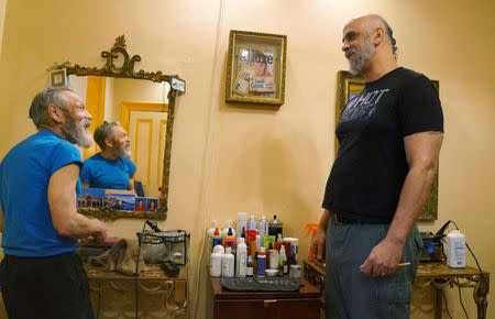 George Lenz (L), and Mike Lujano who have flown a rainbow flag symbolizing LGBT pride for two decades outside their business talk at their salon Edna's in Wheeling, West Virginia, U.S., February 10, 2017. REUTERS/Letitia Stein