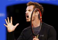 Andy Murray of Britain reacts after hitting a shot against Novak Djokovic of Serbia during their men's singles final match at the Australian Open 2015 tennis tournament in Melbourne February 1, 2015. REUTERS/Issei Kato