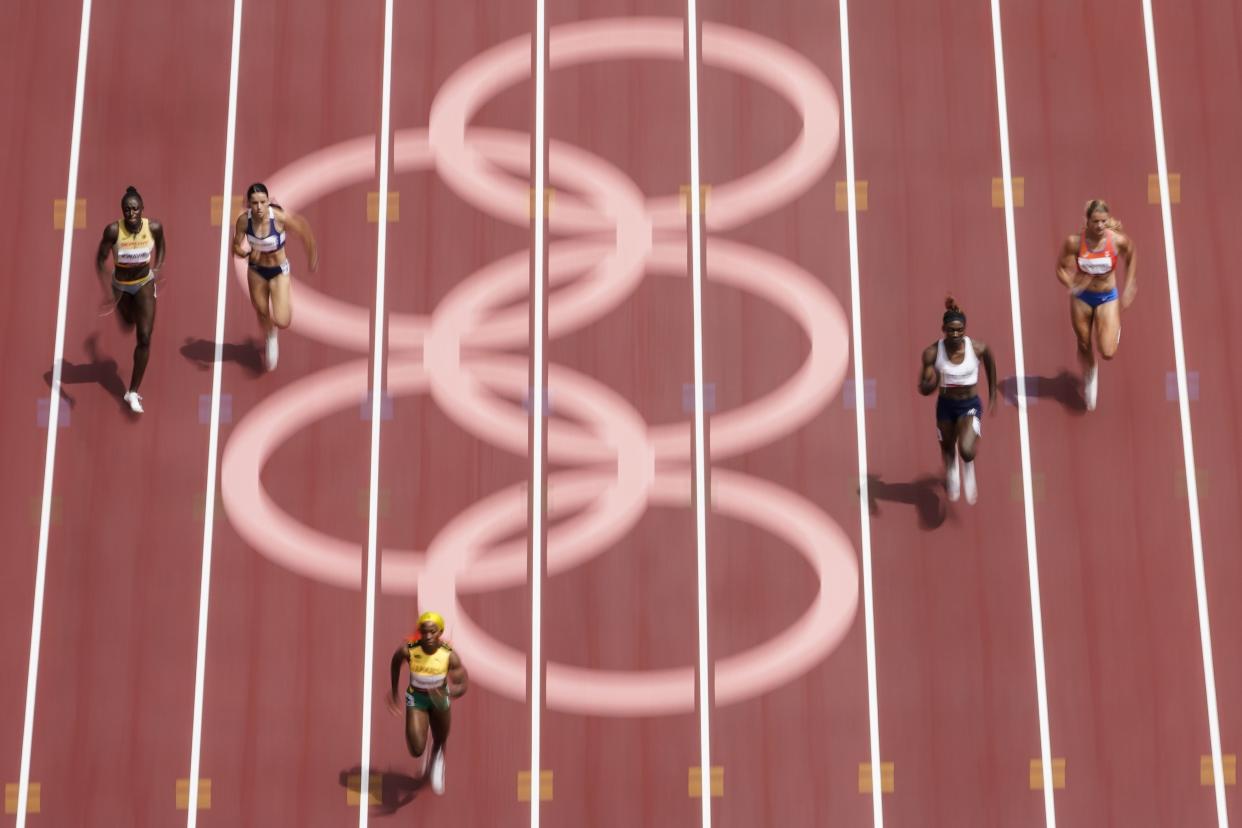 Shelly-Ann Fraser-Pryce, of Jamaica, wins her heat during the semifinals in the women's 200-meter at the 2020 Summer Olympics, Monday, Aug. 2, 2021, in Tokyo.