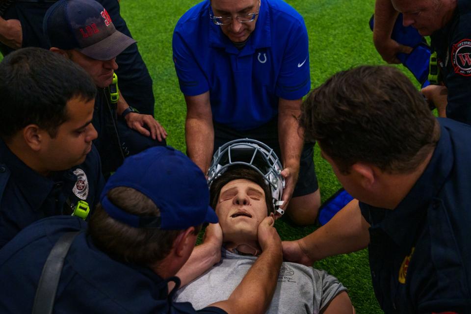 With the Indianapolis Colts reporting to Grand Park Sports Campus in just a few days, the Westfield Fire Department meets with Colts head athletic trainer Dave Hammer (middle) on Thursday, July 21, 2022, to work through possible practice injury scenarios.