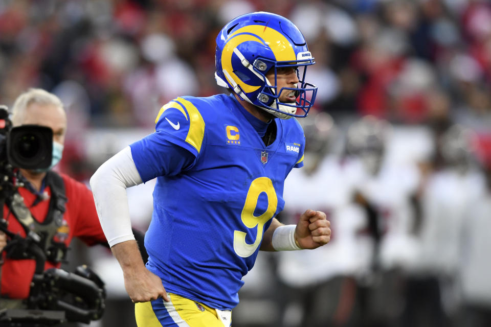 Los Angeles Rams quarterback Matthew Stafford (9) pumps his fist after his 1-yard touchdown run against the Tampa Bay Buccaneers during the second half of an NFL divisional round playoff football game Sunday, Jan. 23, 2022, in Tampa, Fla. (AP Photo/Jason Behnken)