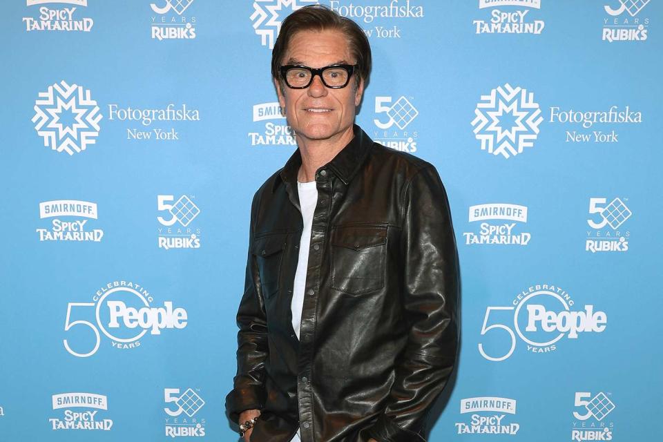 <p>Dimitrios Kambouris/Getty Images</p> Harry Hamlin attends the opening of the PEOPLE: Celebrating 50 Years exhibit in New York City on May 9, 2024