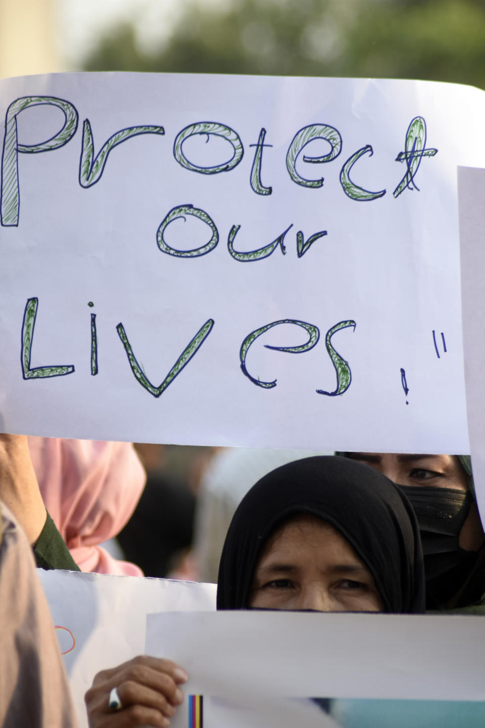 A social group, Aurat March, hold signs during a demonstration against Pakistani government, in Islamabad, Pakistan, Sunday, Oct. 29, 2023. Pakistan says it has recently announced plans to deport all migrants who are in the country illegally, including 1.7 million Afghans, who will be implemented in a "phased and orderly manner." (AP Photo/W.K. Yousafzai)