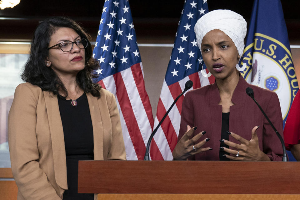 FILE - In this July 15, 2019, file photo, U.S. Rep. Ilhan Omar, D-Minn, right, speaks, as U.S. Rep. Rashida Tlaib, D-Mich. listens, during a news conference at the Capitol in Washington. The U.S. envoy to Israel said he supports Israel's decision to deny entry to two Muslim congresswomen ahead of their planned visit to Jerusalem and the West Bank. Ambassador David Friedman said Thursday, Aug. 15, 2019, in a statement following the Israeli government's announcement that Israel 