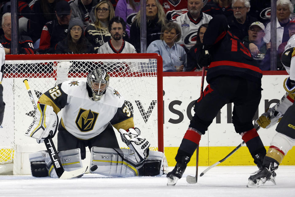 Carolina Hurricanes' Jesse Puljujarvi (13) has his shot blocked by Vegas Golden Knights goaltender Jonathan Quick (32) during the first period of an NHL hockey game in Raleigh, N.C., Saturday, March 11, 2023. (AP Photo/Karl B DeBlaker)