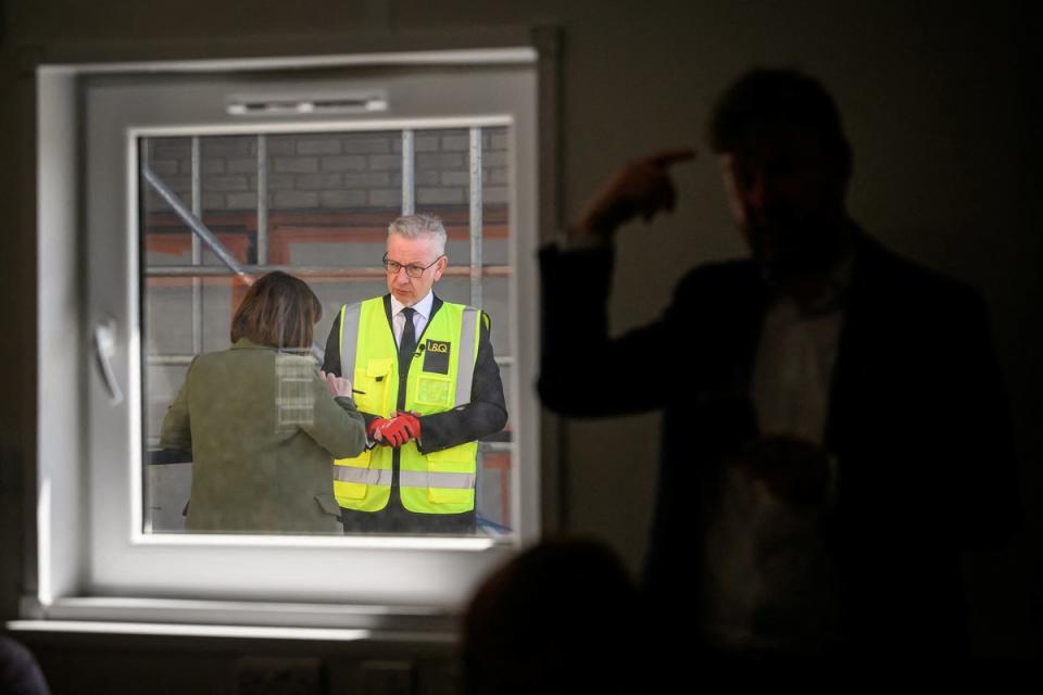 Beth Rigby catches up with Gove during the housing site visit (Reuters)