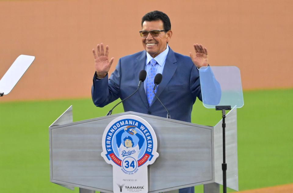 Aug 11, 2023; Los Angeles, California, USA; Los Angeles Dodgers pitcher Fernando Valenzuela (34) speaks during a ceremony to retire his jersey number prior to a game against the Colorado Rockies at Dodger Stadium.