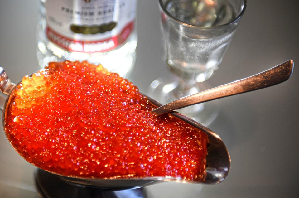 Salmon fish eggs, also known as red caviar in Russia, are pictured in Moscow on November 22, 2021. Russians looking to indulge in their traditional winter holiday treat of red caviar will be disappointed this year, after the state statistics agency said Monday that prices hit historic highs. With Russia battling surging inflation, Rosstat said the market price for one kilogramme of red fish roe has surpassed the 5,000 ruble ($68/60 euro) mark, the highest price since monitoring began in 2000. / AFP / Alexander NEMENOV