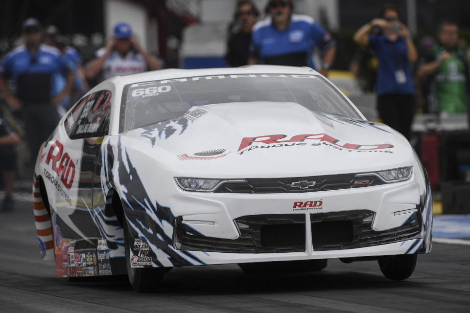 In this photo provided by the NHRA, Pro Stock rookie Dallas Glenn drives in qualifying Saturday, May 22, 2021, for the Mopar Express Lane NHRA SpringNationals drag races at Houston Raceway Park in Baytown, Texas. (Jerry Foss/NHRA via AP)