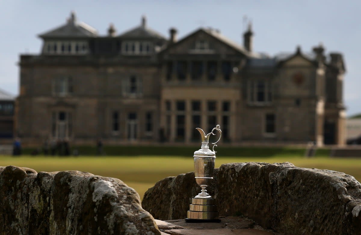 The Claret Jug sits by the Swilcan Bridge in front of the R&A clubhouse at St Andrews (PA Archive) (PA Archive)