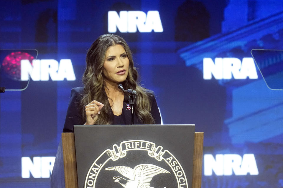 South Dakota Gov. Kristi Noem speaks at the National Rifle Association Convention, Friday, April 14, 2023, in Indianapolis. (AP Photo/Darron Cummings)