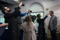 ADDS ID - Associated Press journalist Kevin Freking has his temperature checked before a coronavirus task force briefing, at the White House, Tuesday, March 17, 2020, in Washington. (AP Photo/Evan Vucci)