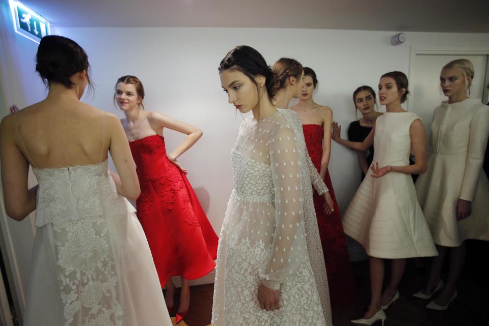 Models wait backstage prior to the Valentino Spring Summer 2013 Haute Couture fashion collection, presented in Paris, Wednesday, Jan. 23, 2013. (AP Photo/Christophe Ena)