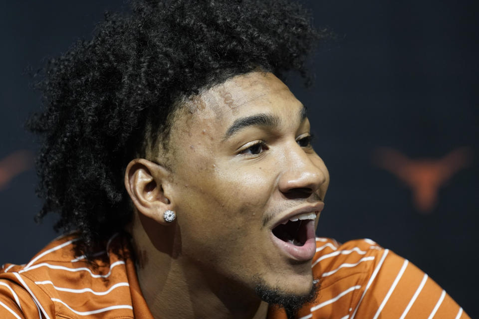 Texas' Dillon Mitchell talks to the media during the NCAA college Big 12 men's basketball media day Wednesday, Oct. 18, 2023, in Kansas City, Mo. (AP Photo/Charlie Riedel)