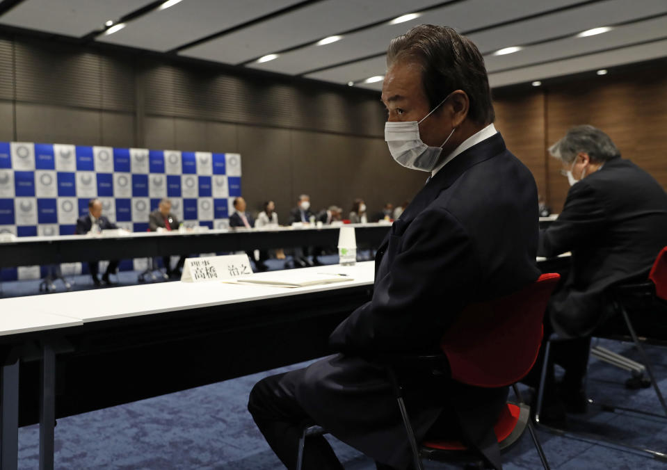 Haruyuki Takahashi, executive board member of the Tokyo Organizing Committee of the Olympic and Paralympic Games attends the Tokyo 2020 Executive Board Meeting in Tokyo, Japan Monday, March 30, 2020. Tokyo Olympic President Yoshiro Mori said Monday he expects to talk with IOC President Thomas Bach this week about potential dates and other details for the rescheduled games next year. (Issei Kato/Pool Photo via AP)