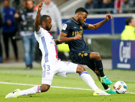 Football Soccer - Olympique Lyon v Monaco - French Ligue 1 - Stade de Lyon – Decines, France - 23/4/2017 Olympique Lyon's Nicolas Nkoulou (L) in action against Monaco's Thomas Lemar (R) REUTERS/Robert Pratta