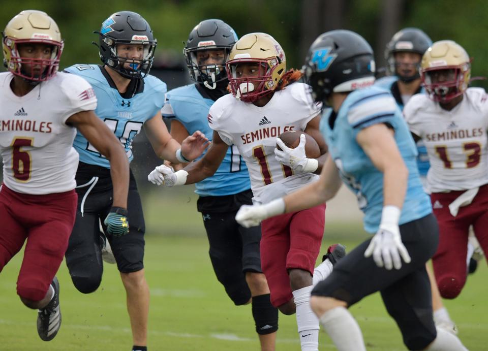 Seminoles WR Keisean Inman (11) brings the opening kickoff downfield to the Sharks 20 yard line. The Ponte Vedra High School Sharks hosted Florida State University High School Friday, September 2, 2022.