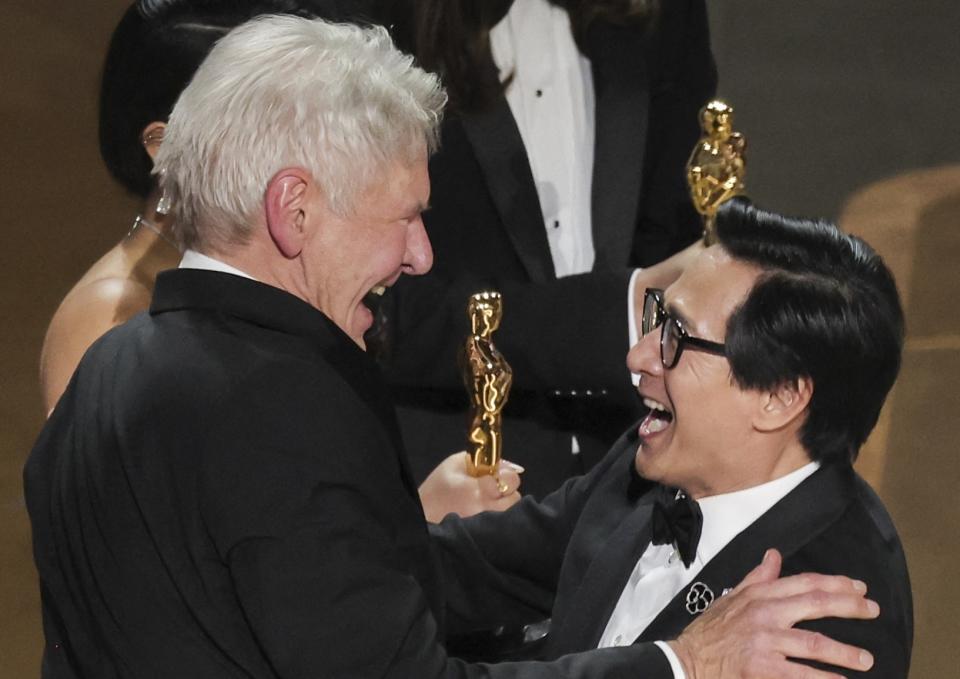 Harrison Ford and Ke Huy Quan shared a touching moment on the Oscars stage (Reuters)