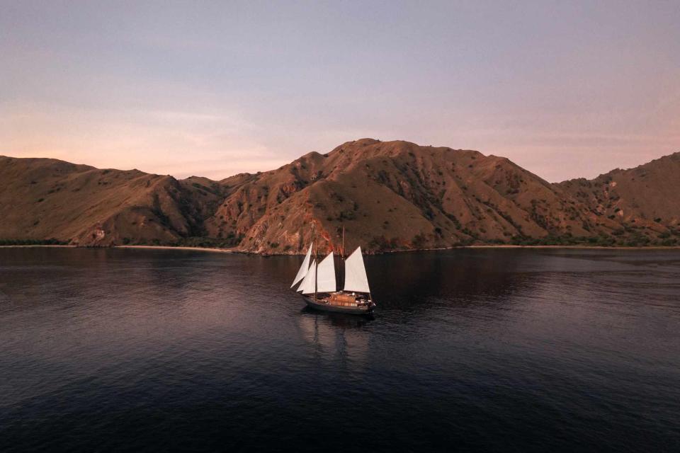 <p>Emilio Kuzma-Floyd/Courtesy of Vela</p> The Vela enters Batu Moncho Bay, in Komodo National Park.