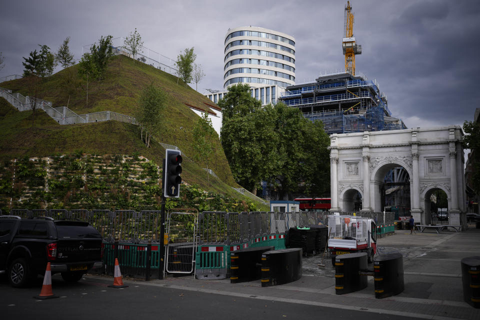 The newly built "Marble Arch Mound" after it was opened to the public next to Marble Arch in London, Tuesday, July 27, 2021. The temporary installation commissioned by Westminster Council and designed by architects MVRDV has been opened as a visitor attraction to try and entice shoppers back to the adjacent Oxford Street after the coronavirus lockdowns. (AP Photo/Matt Dunham)