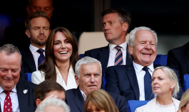 <p>Michael Steele - World Rugby/World Rugby via Getty</p> Kate with Sir Bill Beaumont CBE at England's Rugby World Cup match on Sunday