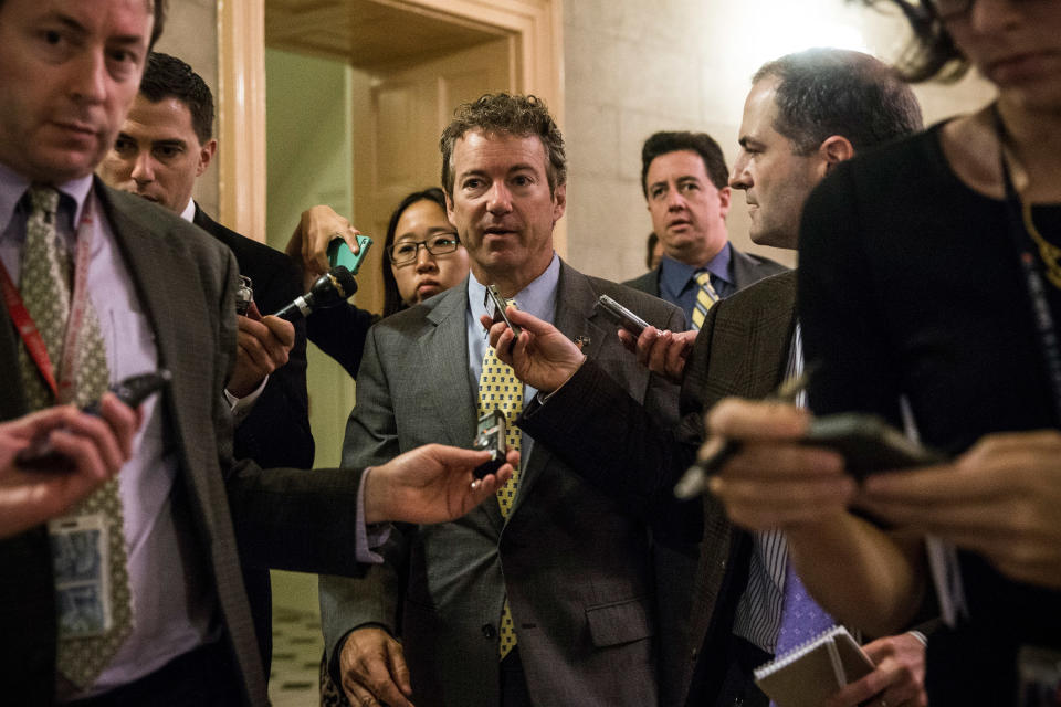 WASHINGTON, DC - OCTOBER 16:  Sen. Rand Paul (R-KY) answers questions as he arrives for a meeting of Senate Republicans on a solution for the pending budget and debt limit impasse at the U.S. Capitol October 16, 2013 in Washington, DC. The U.S. government shutdown is in its sixteenth day as the U.S. Senate and House of Representatives remain gridlocked on funding the federal government and the extending the nation's debt limit.  (Photo by Andrew Burton/Getty Images)