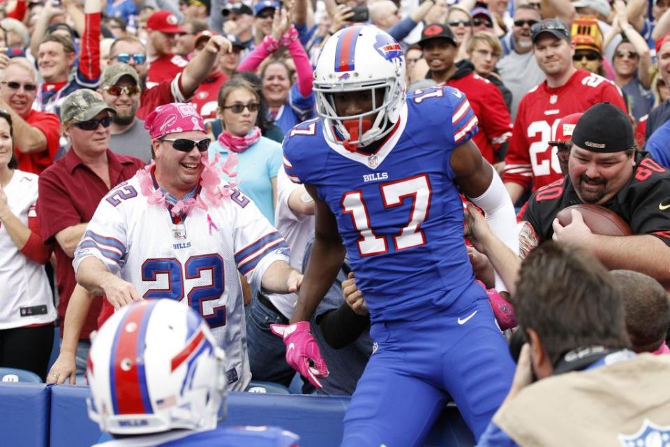 Oct 16, 2016; Orchard Park, NY, USA; Buffalo Bills wide receiver Justin Hunter (17) jumps in the stands after scoring a touchdown during the second half against the San Francisco 49ers at New Era Field. Buffalo beat San Francisco 45-16. Mandatory Credit: Kevin Hoffman-USA TODAY Sports