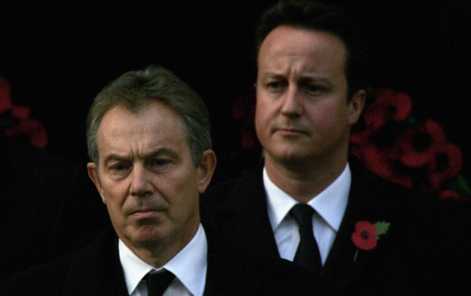 LONDON - NOVEMBER 12:  Britain's Prime Minister Tony Blair (L) and leader of the Conservative Party David Cameron arrive to attend the Remembrance Sunday Service at The Cenotaph on November 12, 2006 in London, England. The Festival of Remembrance is an annual event to honour those who have paid the ultimate sacrifice in the service of their country. The Festival comprises a service of Remembrance and an observance of the Two Minute Silence. It is also an opportunity to think about the Service men and women around the world who are putting their lives at risk protecting our peace and freedom today.  (Photo by Scott Barbour/Getty Images)