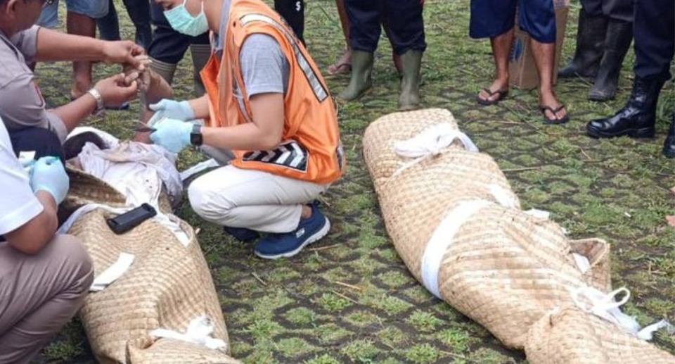 The bodies of tourists killed during a mudslide at in the village of Jatiluwih. 