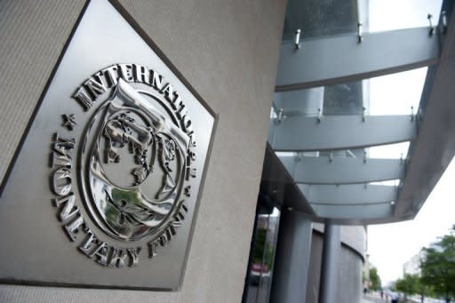 The logo of the International Monetary Fund (IMF) at the organization's headquarters in Washington, DC. Teh IMF looks set to receive the $400 billion it needs to boost a "global firewall" and help stem Europe's debt crisis, Japan's finance minister said