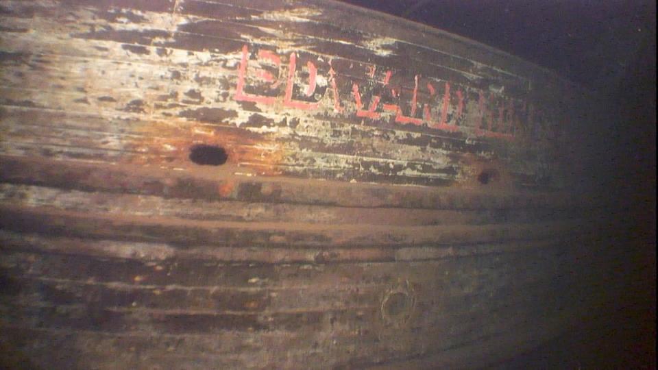 The Edward Hines Lumber Company name is visible on the shipwreck.