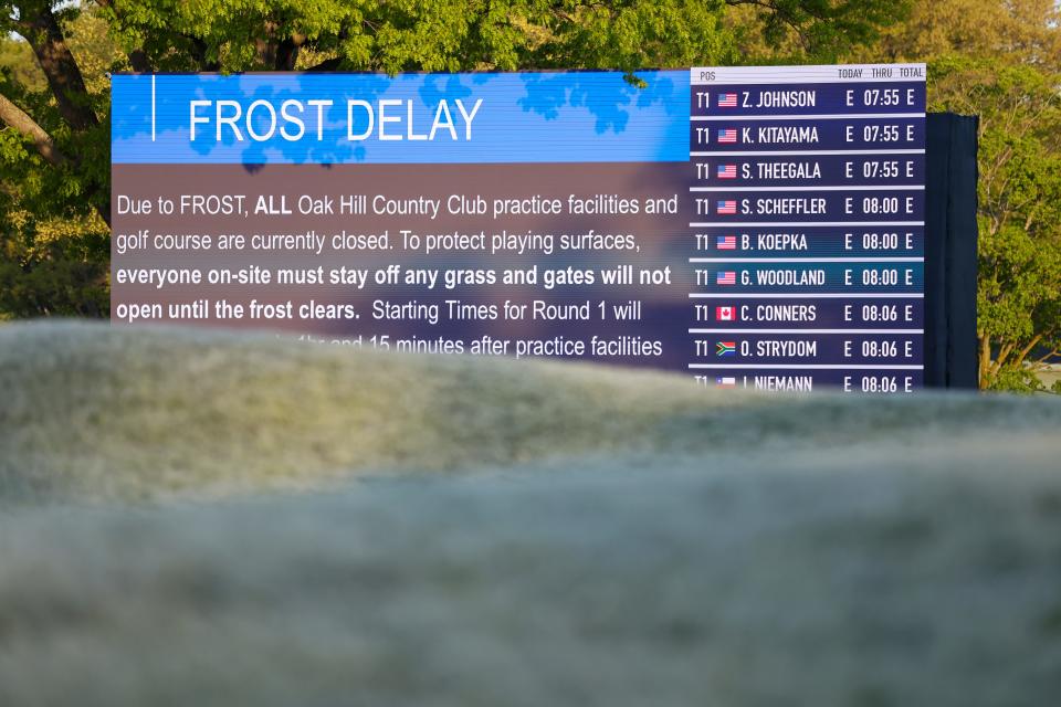 A frost delay message is displayed on a leaderboard prior to the first round of the 2023 PGA Championship at Oak Hill Country Club.