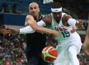 Aug 17, 2016; Rio de Janeiro, Brazil; Argentina shooting guard Manu Ginobili (5) and USA forward Carmelo Anthony (15) go after a loose ball during the men's basketball quarterfinals in the Rio 2016 Summer Olympic Games at Carioca Arena 1. Mandatory Credit: Jeff Swinger-USA TODAY Sports