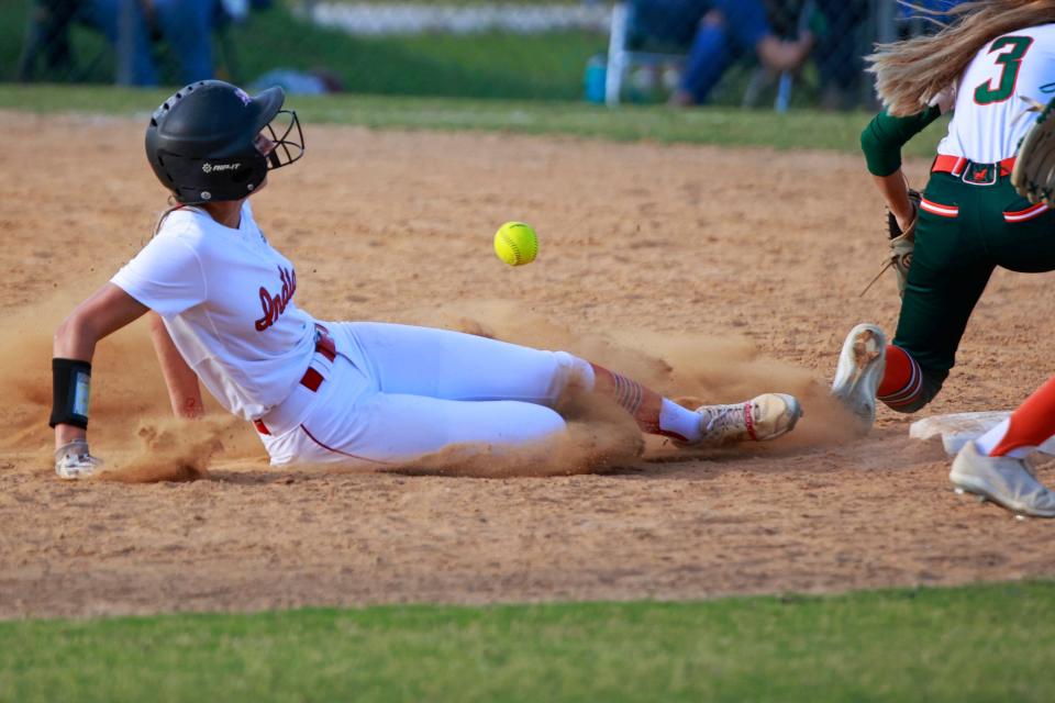 Baldwin runner Kendall North (8) slides into second base to beat the throw to Mandarin infielder Ryleigh Booth during the Gateway Conference softball final.