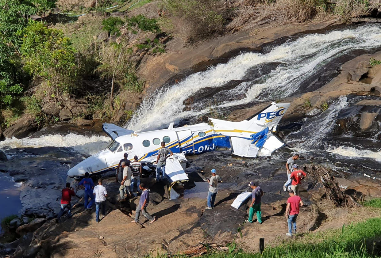 This handout photo released by Minas Gerais Military Firefighters Corps shows the airplane plane that crashed that was transporting Brazilian singer Marilia Mendonca, in the southeastern Brazilian of state Minas Gerais, Friday, Nov. 5, 2021. One of Brazil's most popular singers and a Latin Grammy winner, Mendonca died on Friday, Nov. 5, 2021, in an airplane crash on her way to a concert. Mendonça was 26 and performed country music in Brazil called sertanejo. (Minas Gerais Military Firefighters Corps via AP)