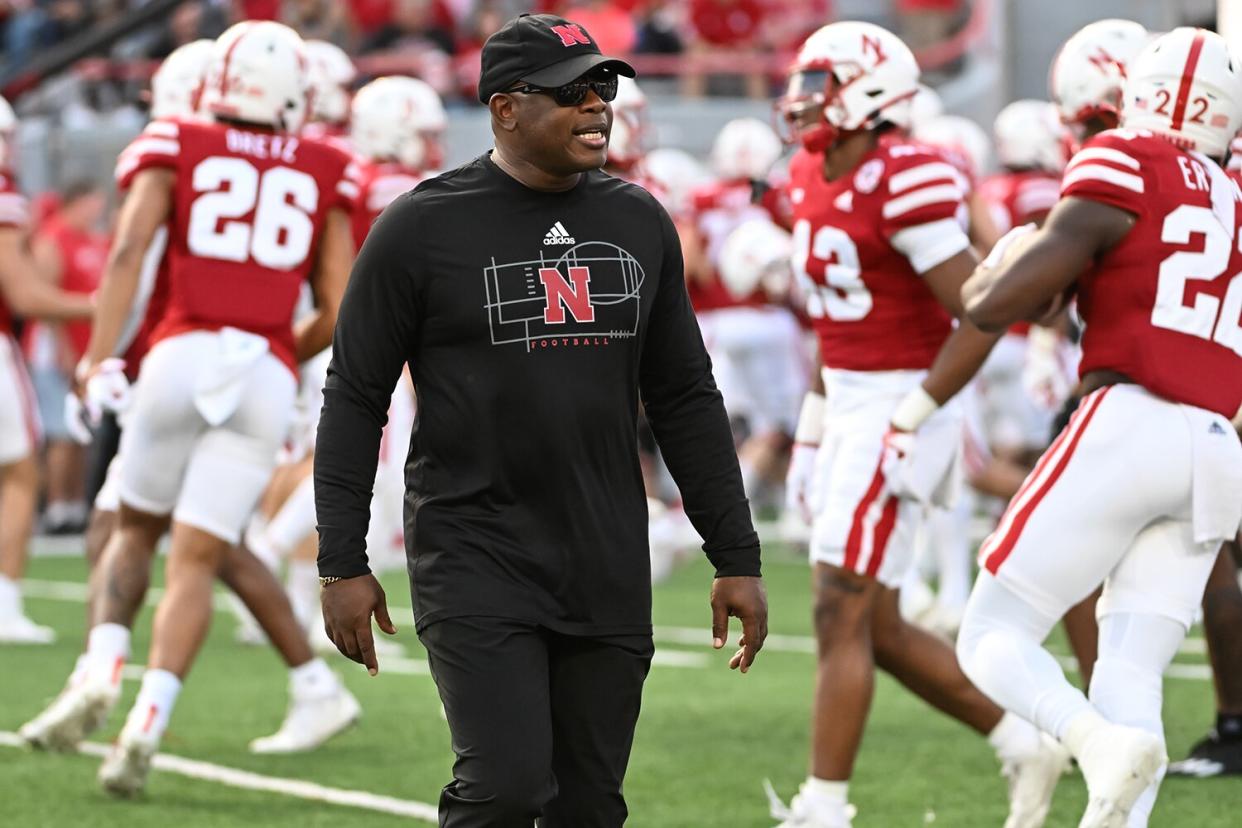Interim head coach Mickey Joseph of the Nebraska Cornhuskers watches the team warm up before the game against the Indiana Hoosiers at Memorial Stadium on October 1, 2022 in Lincoln, Nebraska.