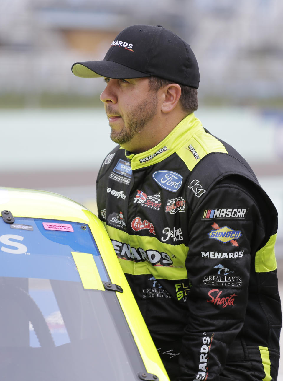 Matt Crafton gets in his truck before practice for a NASCAR Truck Series auto race on Friday, Nov. 15, 2019, at Homestead-Miami Speedway in Homestead, Fla. Crafton is one of four drivers racing for the series championship. (AP Photo/Terry Renna)