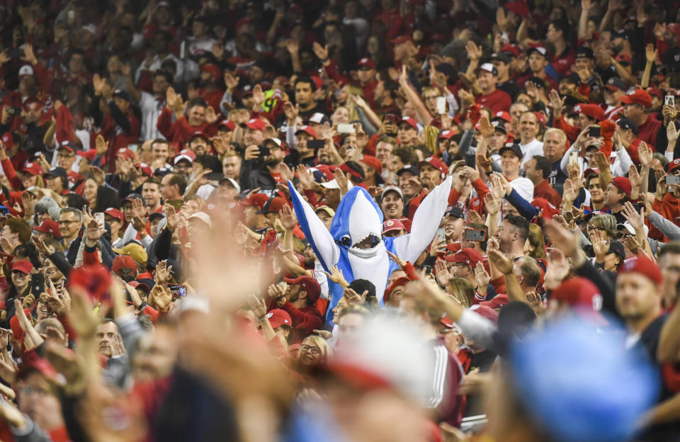 Nats fans doing their "Baby Shark" celebration during NLCS. (Photo by Toni L. Sandys/The Washington Post via Getty Images)