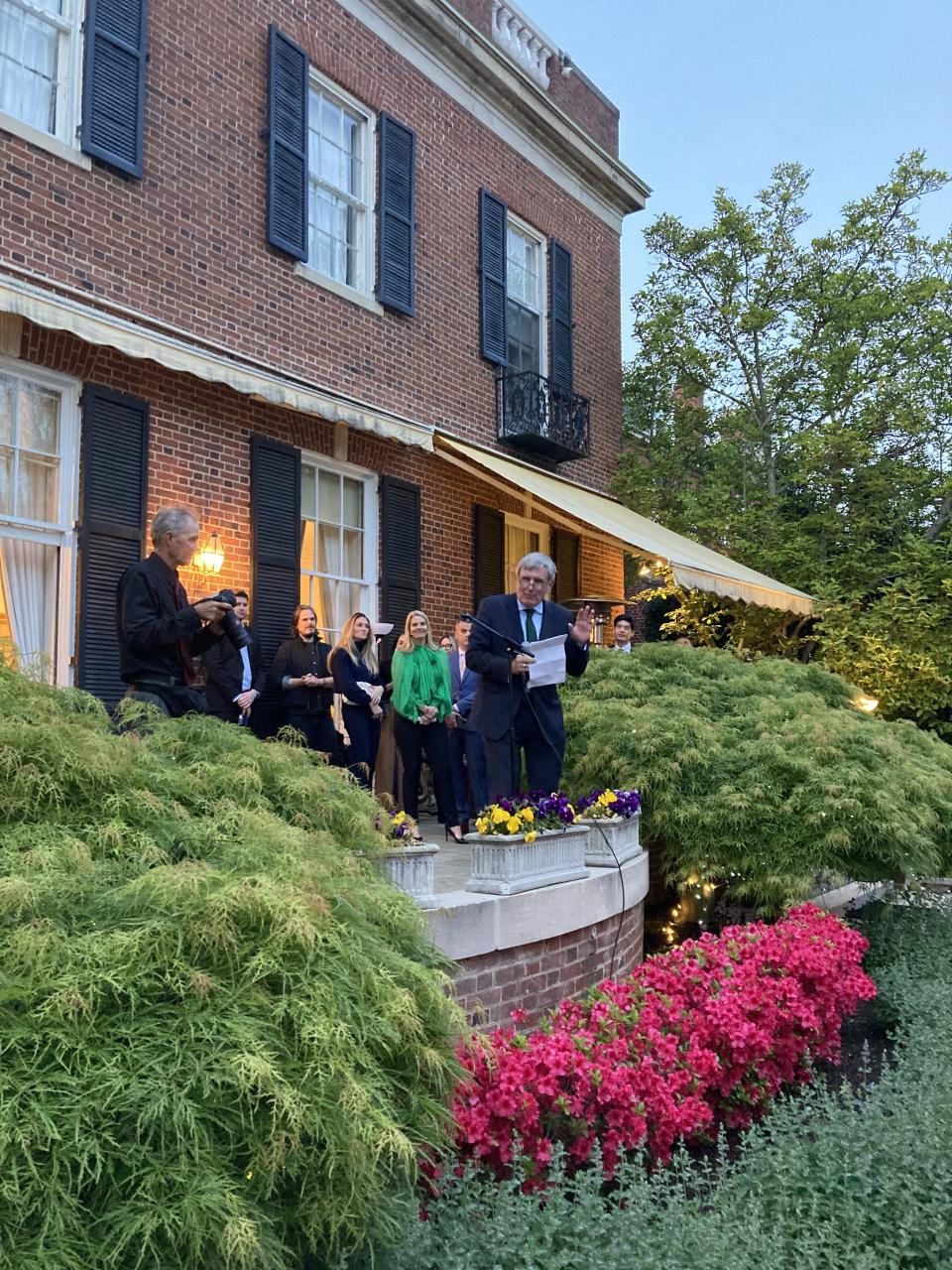 Daniel Mulhall, Ireland’s ambassador to the United States, speaks to a crowd at his home on Thursday night.