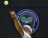 Kei Nishikori of Japan serves during his match against Simone Bolelli of Italy at the Wimbledon Tennis Championships in London, June 29, 2015. REUTERS/Toby Melville