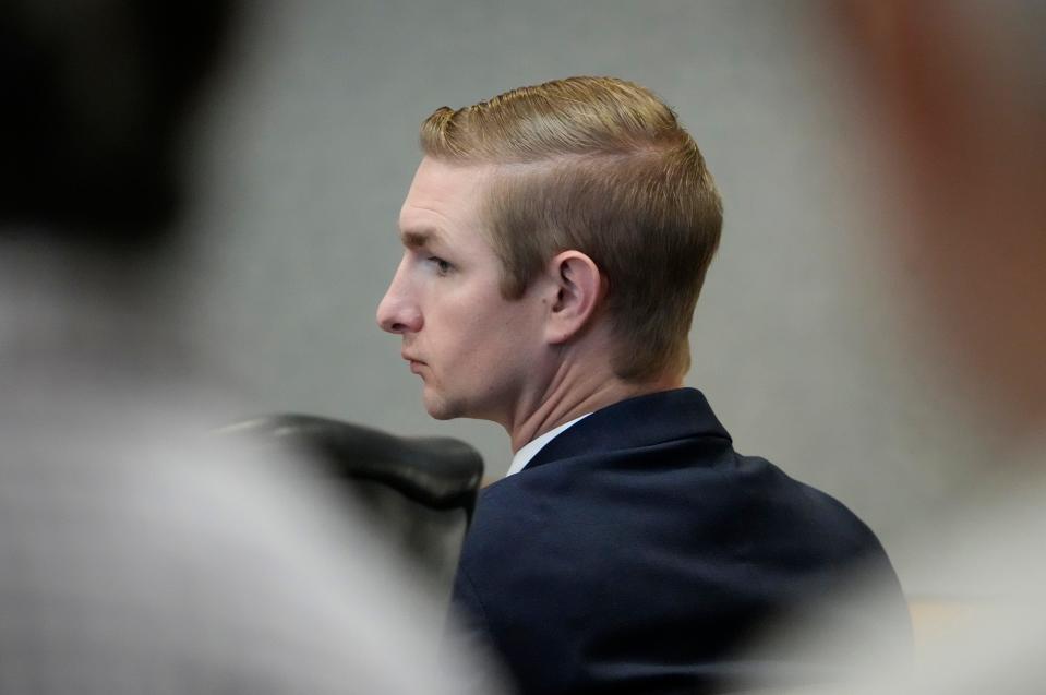 Austin police officer Christopher Taylor listens during his murder trial at the Blackwell-Thurman Criminal Justice Center on Tuesday November 7, 2023. Taylor is charged with killing of Michael Ramos in 2020.