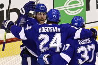 Tampa Bay Lightning center Blake Coleman (20) celebrates with Zach Bogosian (24) and Yanni Gourde (37) after scoring against the Boston Bruins during the first period of Game 2 of an NHL hockey second-round playoff series, Tuesday, Aug. 25, 2020, in Toronto. (Frank Gunn/The Canadian Press via AP)