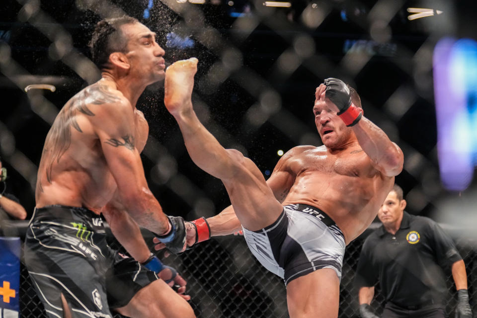 PHOENIX, AZ - MAY 7: (R-L) Michael Chandler knocks out Tony Ferguson with a front kick in their Lightweight bout during the UFC 274 event at Footprint Center on May 7, 2022, in Phoenix, Arizona. (Photo by Louis Grasse/PxImages/Icon Sportswire via Getty Images)