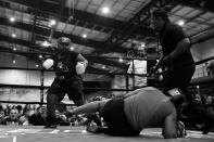 <p>Britnney Saxon knocks down Destyni Bynoe during a women’s match during the “Bronx Tough Turkey Tussle” at the New York Expo Center in the Bronx, New York, on Nov. 16, 2017. (Photo: Gordon Donovan/Yahoo News) </p>