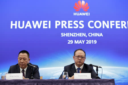 Huawei's Chief Legal Officer Song Liuping ( L) and Huawei's Western Europe President Vincent Pang attend a news conference on Huawei’s ongoing legal action against the U.S. government’s National Defense Authorization Act (NDAA) action at the company's headquarters in Shenzhen, Guangdong province, China May 29, 2019. REUTERS/Jason Lee