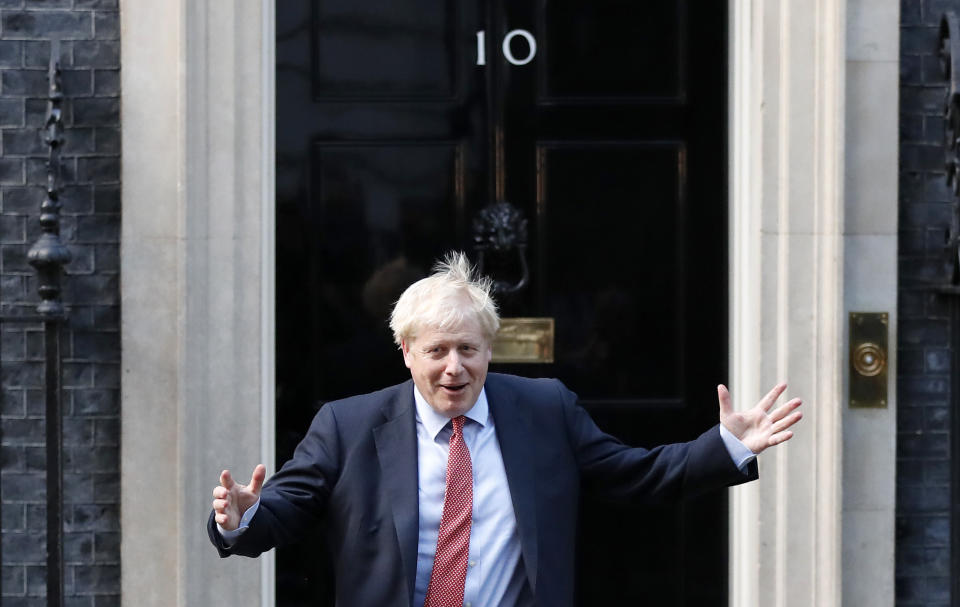 Britain's Prime Minister Boris Johnson leaves 10 Downing Street to welcome the President of the European Parliament David Sassol in London, Tuesday, Oct. 8, 2019.(AP Photo/Frank Augstein)